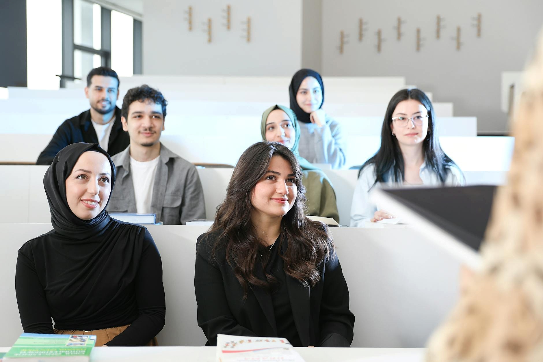 Students participating in a financial literacy workshop in a modern classroom setting